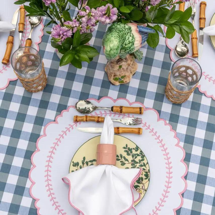 Brazilian Bamboo Napkin Ring on white napkin with peach accent at blue check table setting on Tampa Home & Garden Store