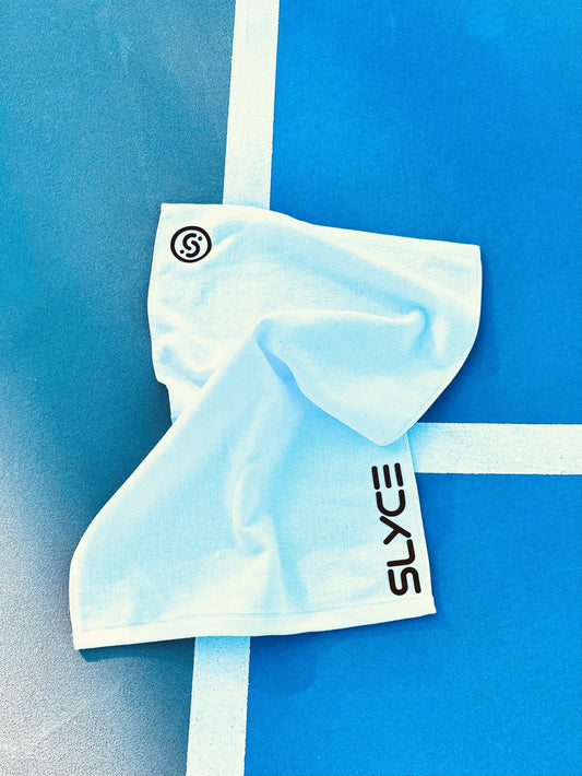 SLYCE Players Towel white towel with SLYCE SPORT logo on blue court with white line on Tampa Home & Garden Store