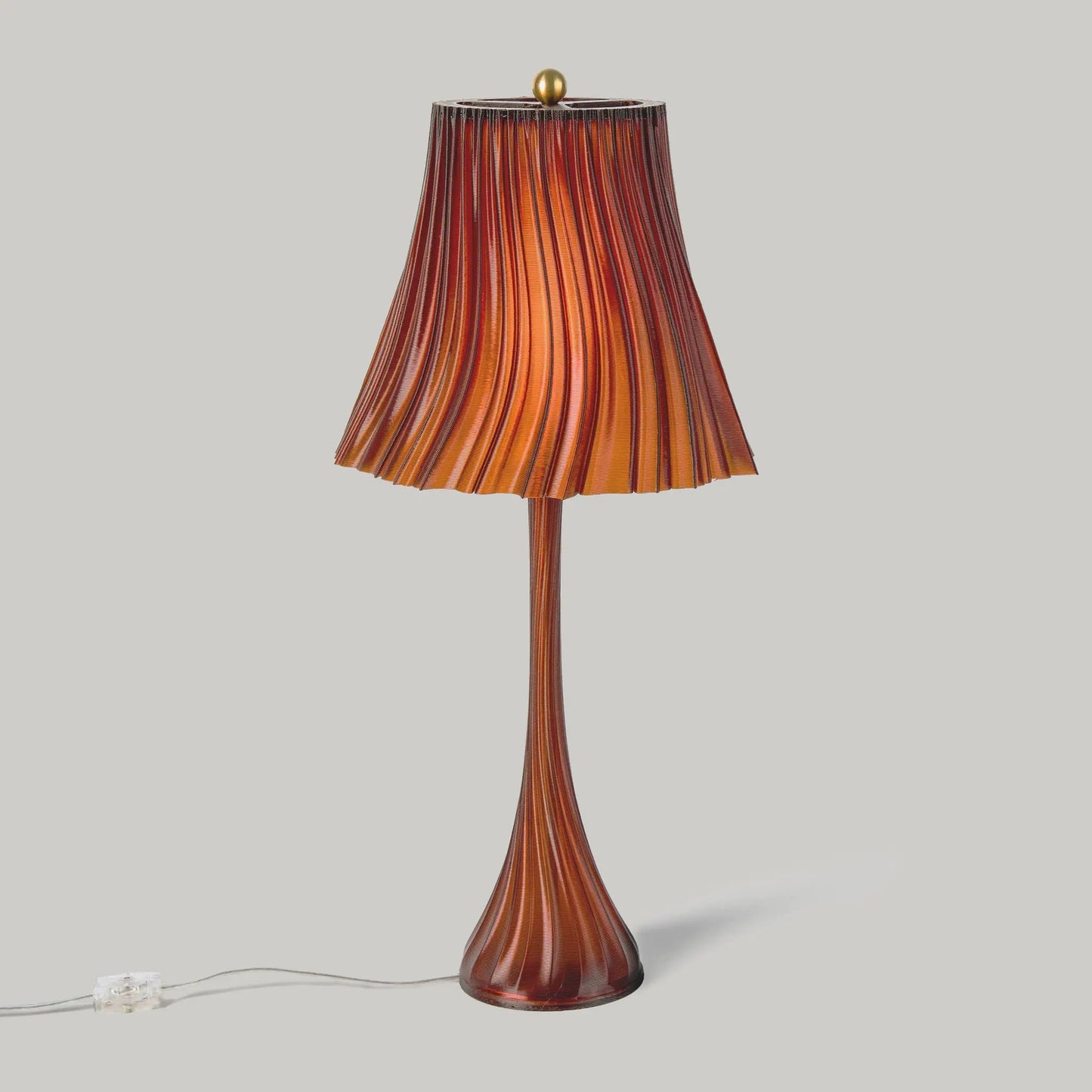 Pleat lamp with flowing silk pleated orange-red shade on glass stem on Tampa Home & Garden Store