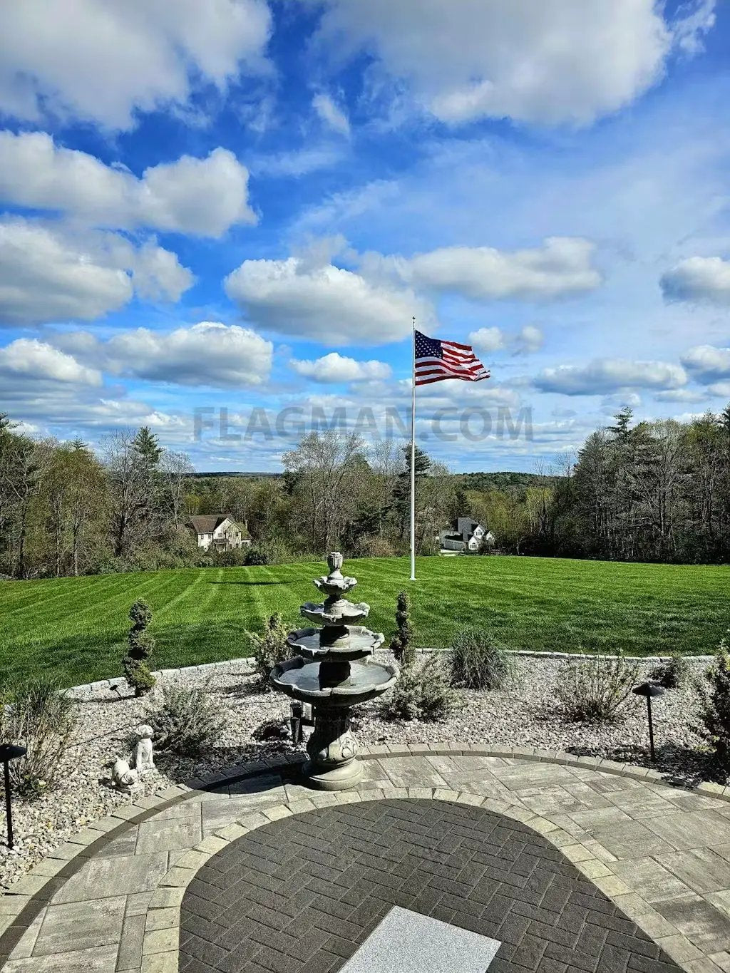 Aluminum flagpole with external rope, heavy-duty, Flagman of America, flag atop a yard on Tampa Home & Garden Store