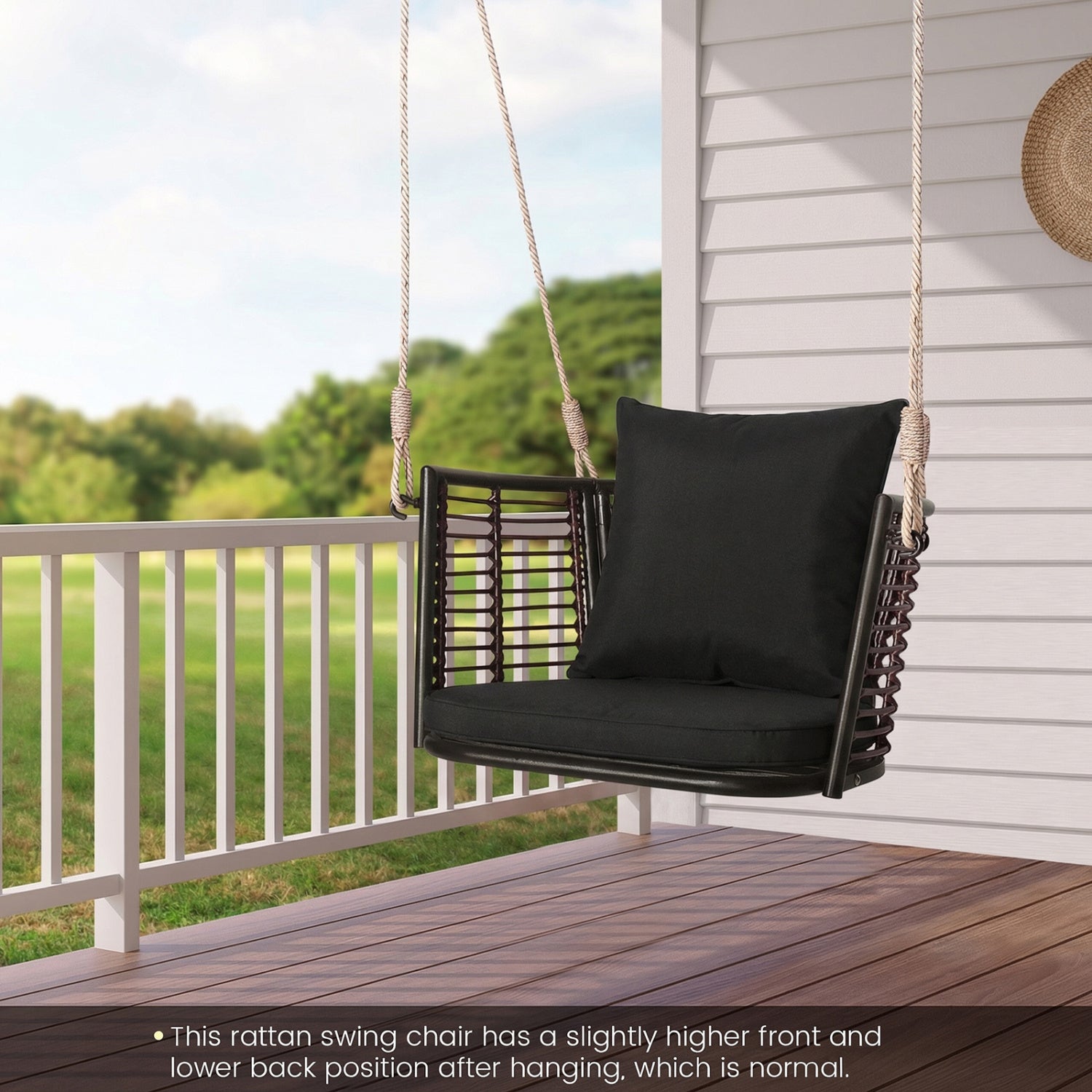 DirectDeals hanging rattan porch swing chair with black cushions on a wooden deck on Tampa Home & Garden Store