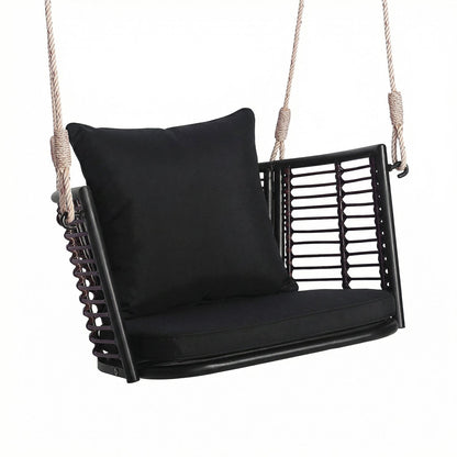 Hanging rattan porch swing chair with black cushions and natural rope suspension on Tampa Home & Garden Store