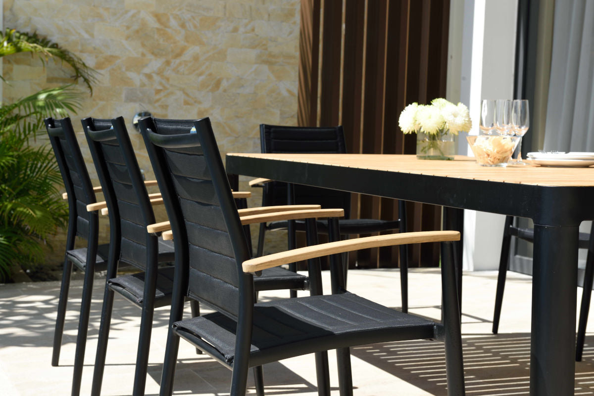 Portals Dark Lite FSC Teak Wood and Aluminum Dining Set with teak tabletop and black frame on Tampa Home & Garden Store