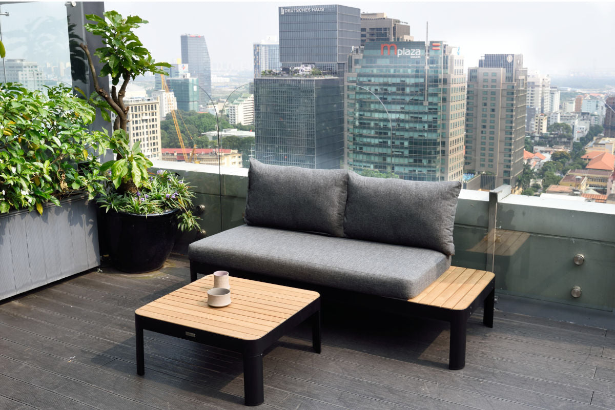 Portals Dark 2-Seat Outdoor Sofa with grey cushions and black frame on rooftop patio on Tampa Home & Garden Store