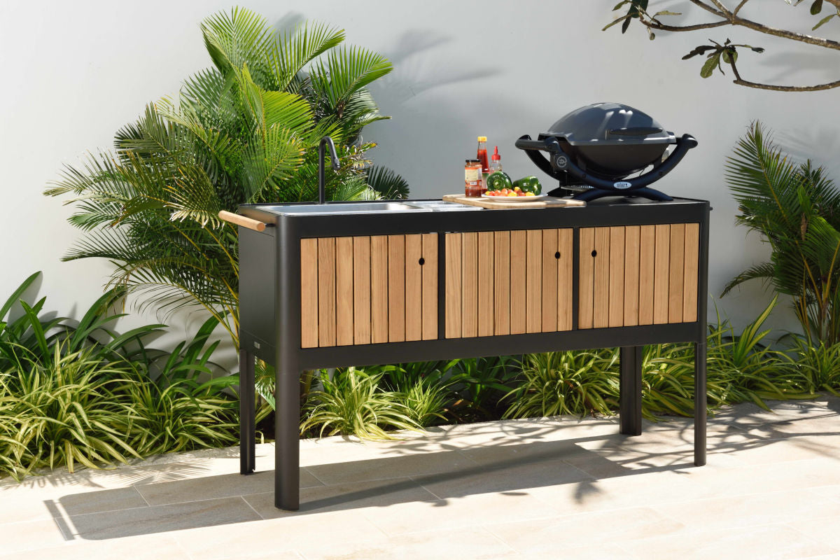 Portals dark outdoor kitchen with wood slat doors, sink and grill by LifestyleGarden US on Tampa Home & Garden Store