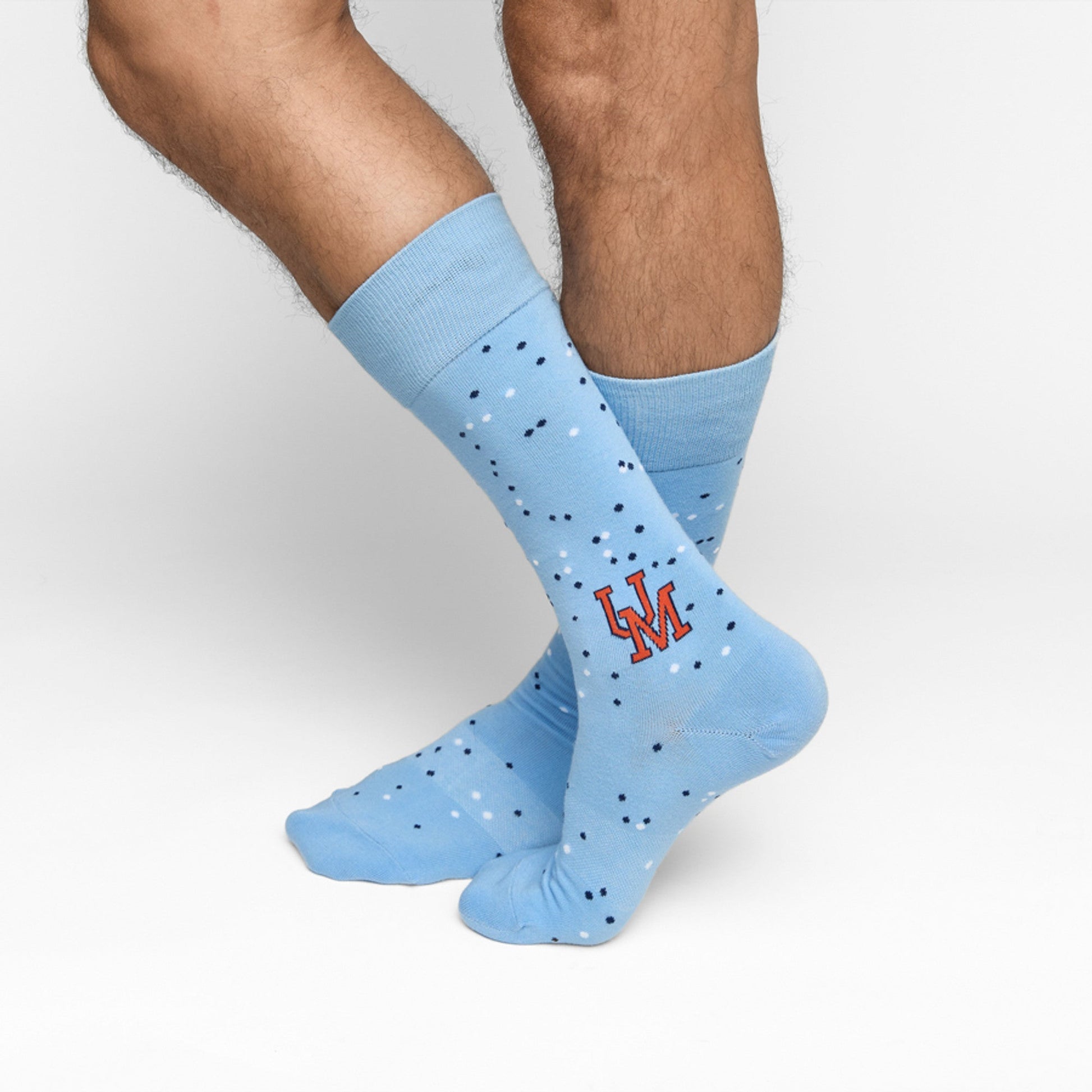 Weekly Sply Vaught licensed college socks by DeadSoxy in light blue with speckled navy dots on Tampa Home & Garden Store