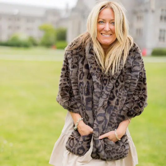 Waterproof Windproof Capelet by Pretty Rugged in leopard faux fur outerwear scarf worn by woman on Tampa Home & Garden Store