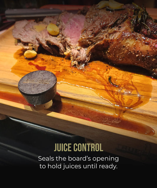 Replacement corks, two black stoppers by The True Board on a wooden board with roasted meat on Tampa Home & Garden Store