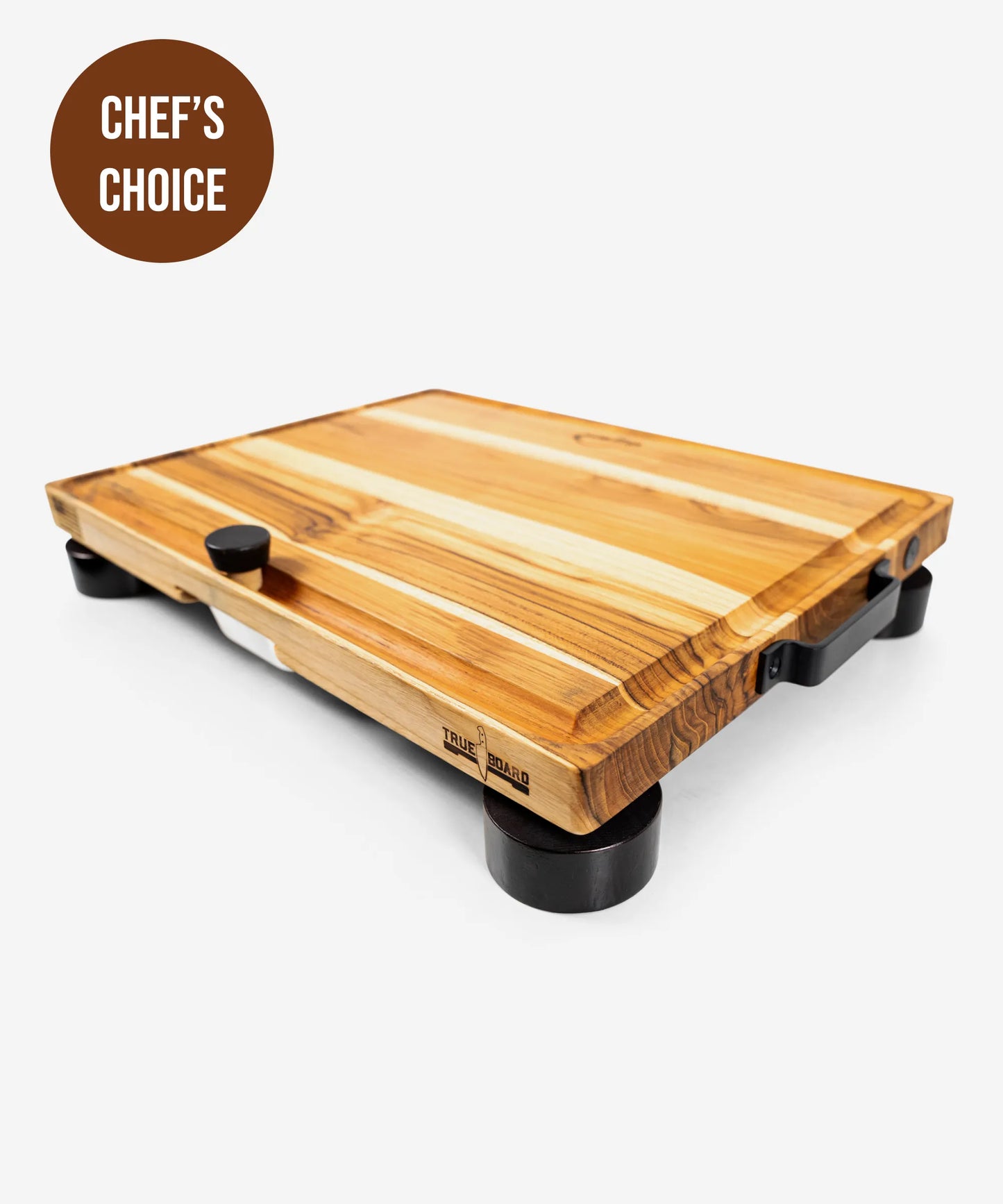 The True Board cutting board with striped wood grain and black feet on Tampa Home & Garden Store
