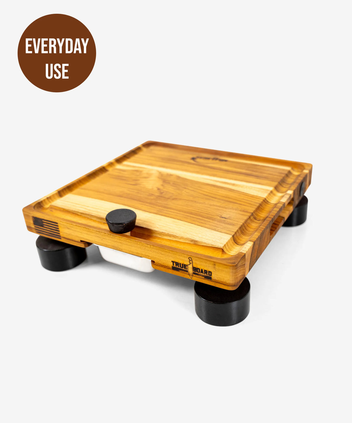 The True Board Compact cutting board with natural wood grain and black feet on Tampa Home & Garden Store