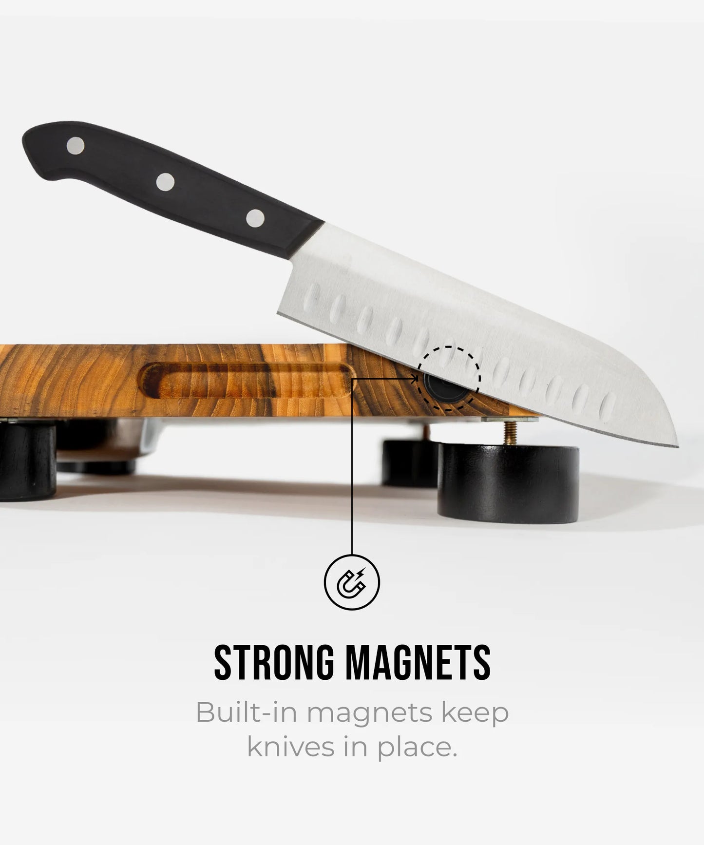 The True Board Compact cutting board with a black-handled chef knife resting on a wooden surface on Tampa Home & Garden Store