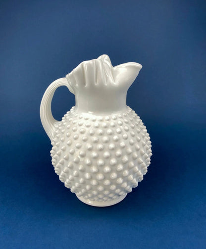 Milk glass pitcher with hobnail body and ruffled rim on Tampa Home & Garden Store