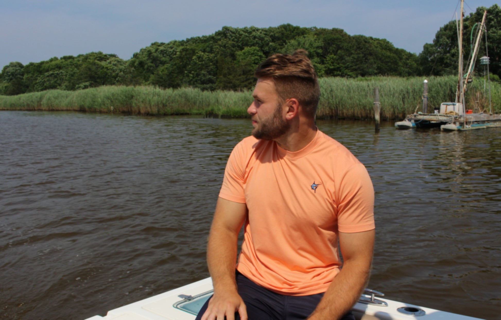 Oasis SS Tee peach short-sleeve shirt with White Water Life logo on chest, man on a boat on Tampa Home & Garden Store