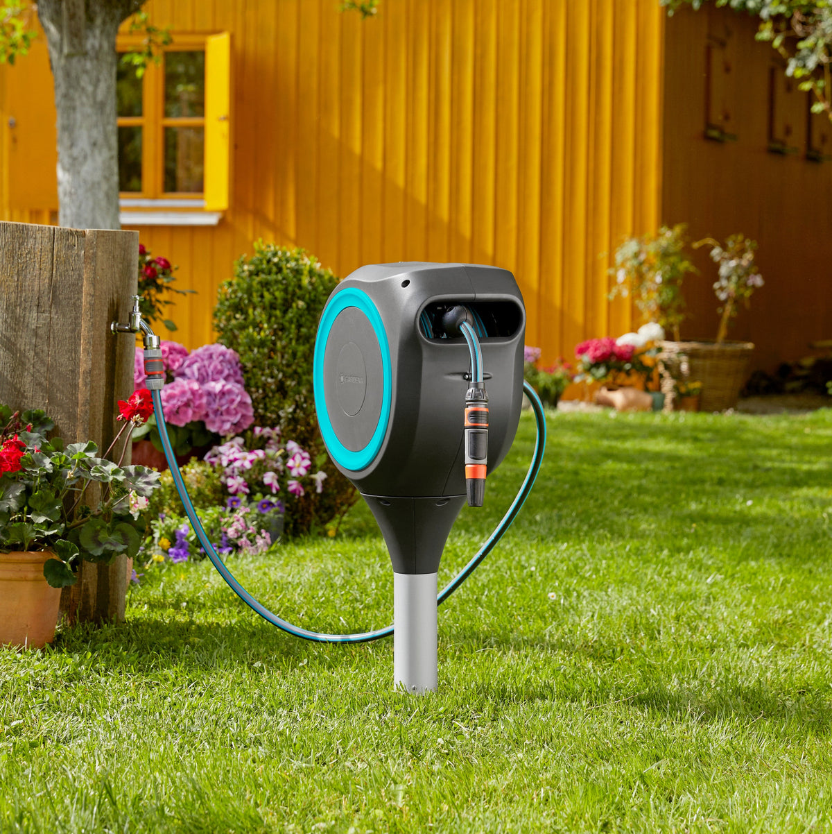 Garden Hose Box RollUp S 15m hose reel Gardena gray with turquoise trim in garden on Tampa Home & Garden Store