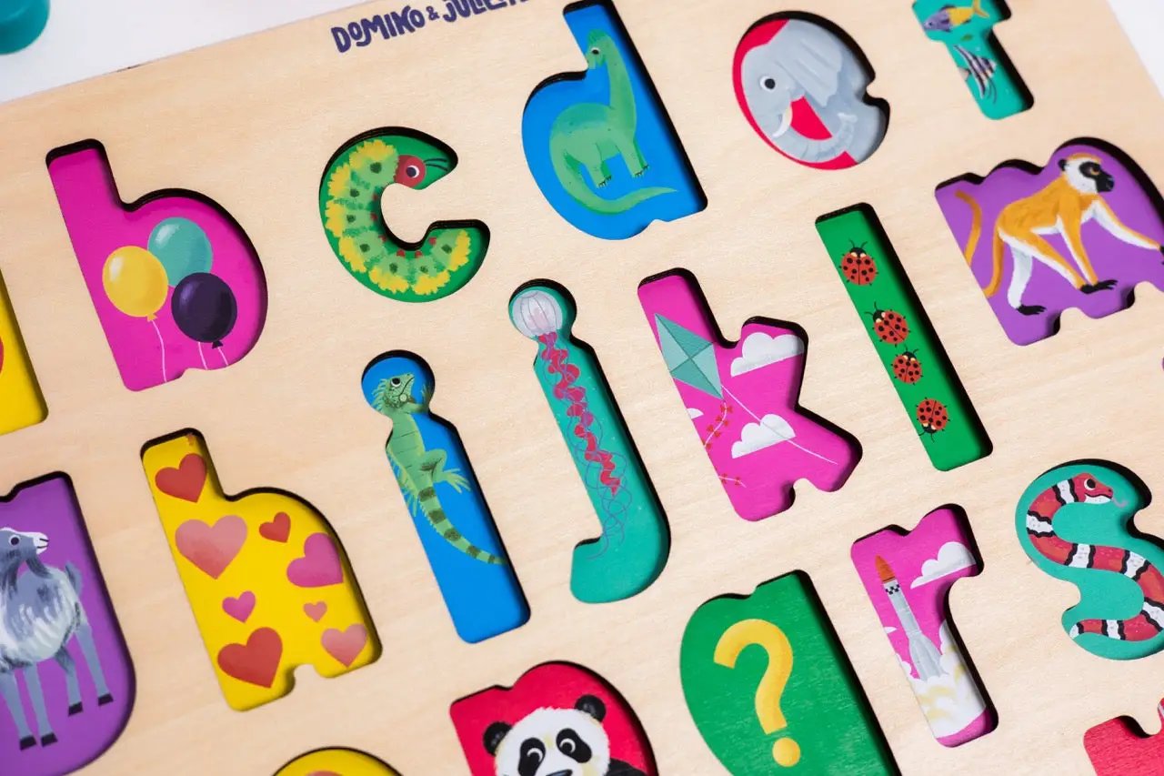 Find & Fit Puzzle by Domino & Juliette; board with colorful letter cutouts and animals on Tampa Home & Garden Store