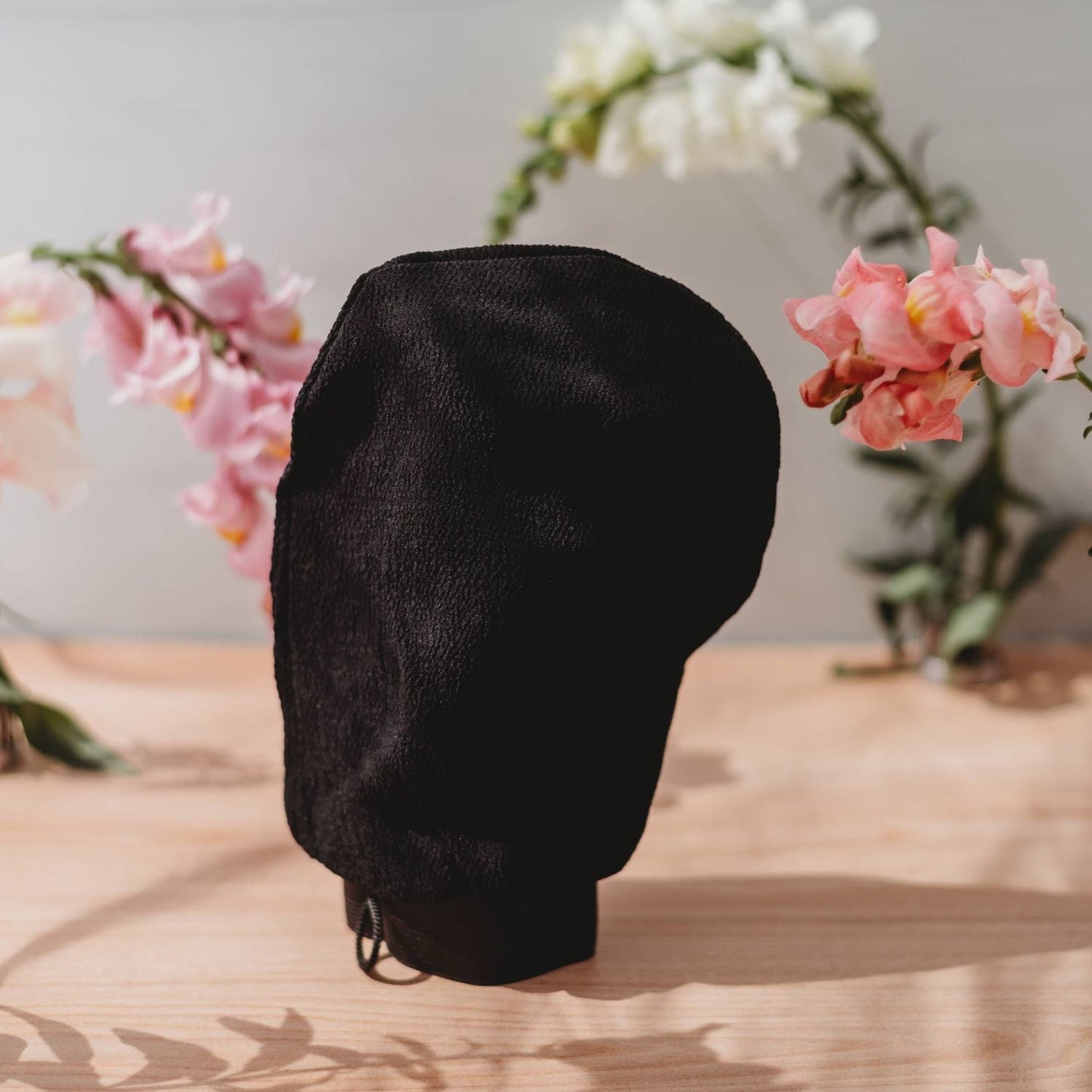 Deep Exfoliating Glove tan applicator in black fabric by Rose Gold Sunless on Tampa Home & Garden Store