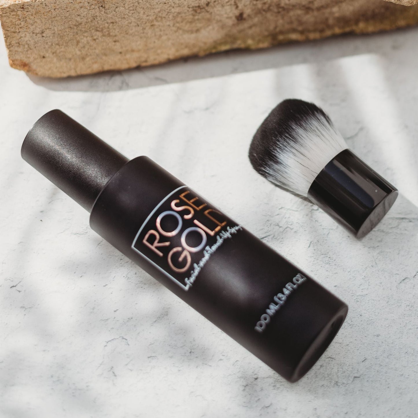 Facial Tanning Mist bottle Rose Gold Sunless with rose gold lettering and brush on marble on Tampa Home & Garden Store