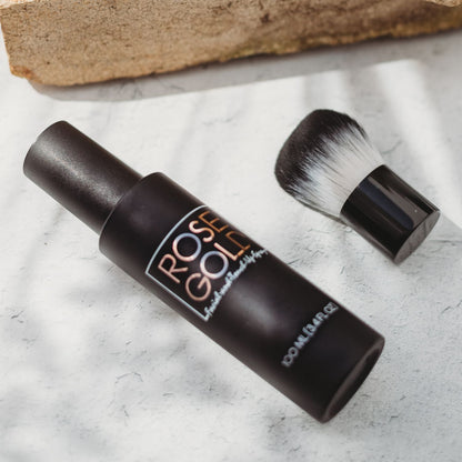 Facial Tanning Mist bottle Rose Gold Sunless with rose gold lettering and brush on marble on Tampa Home & Garden Store