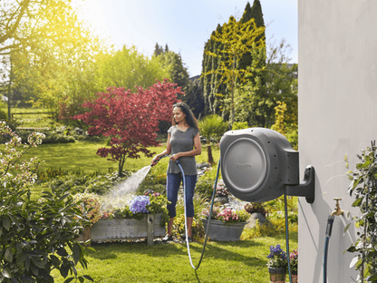 Gardena RollUp 50 ft retractable hose reel with auto retracting wall mounted in a garden on Tampa Home & Garden Store