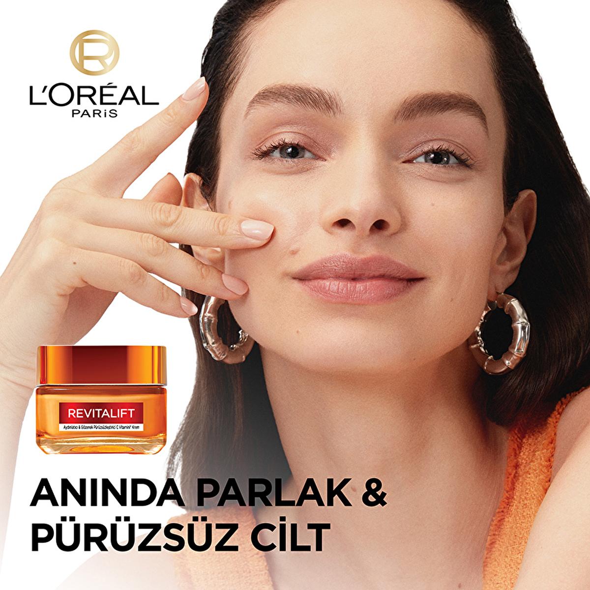 Face cream L’Oréal Paris Revitalift Vitamin C jar in orange beside model on Tampa Home & Garden Store