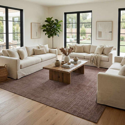 Leanna light brown washable area rug in a neutral living room with cream sofas on Tampa Home & Garden Store