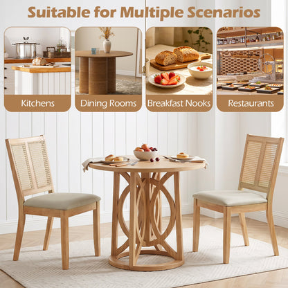 Rattan dining chairs set of 4 with padded seats around a round natural wood table on Tampa Home & Garden Store