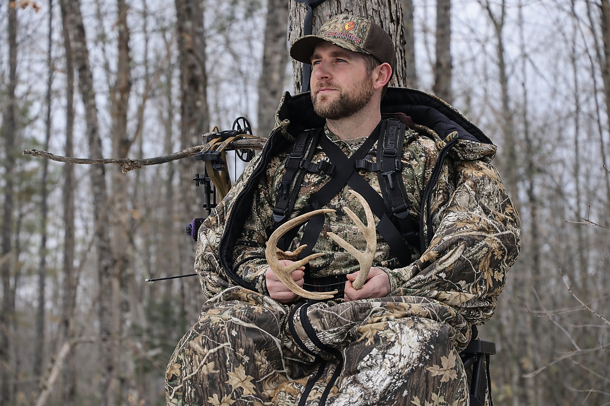 Heater Body Suit AP camo hunting jacket Killz Products worn by hunter in woodland camo on Tampa Home & Garden Store