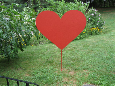 Red metal heart garden stake by Rustica Ornamentals for outdoor lawn decor on Tampa Home & Garden Store
