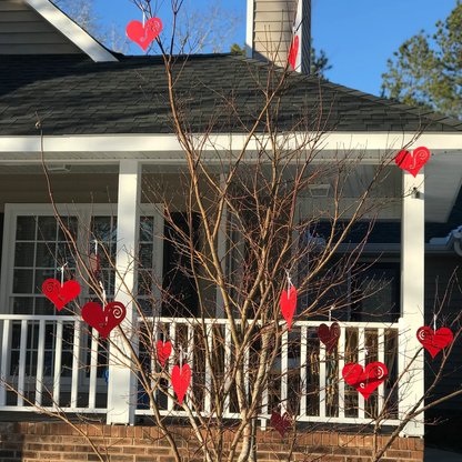 Hanging Heart Tree Ornaments set of 12 red hearts with swirl accents on a bare tree on Tampa Home & Garden Store