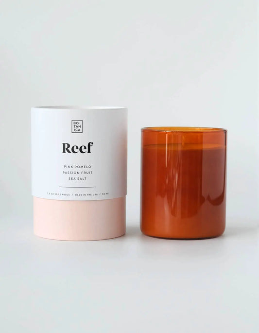 Reef Medium Candle; white label with pink base beside amber jar on Tampa Home & Garden Store
