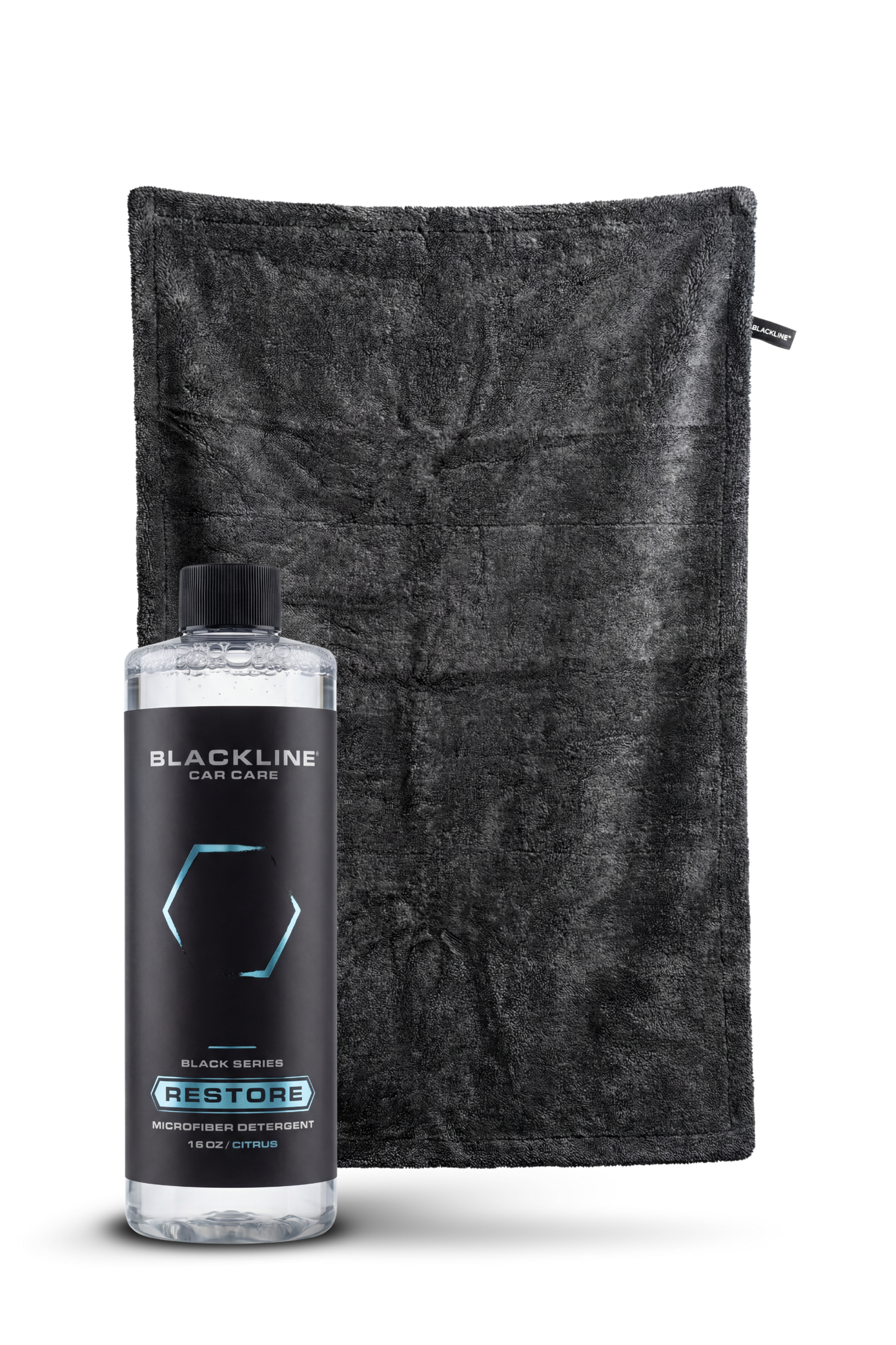 Blackline Restore microfiber detergent bottle beside a black microfiber towel on Tampa Home & Garden Store