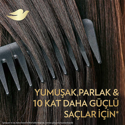 Dove hair repair serum dual-phase formula on dark glossy hair with a black comb on Tampa Home & Garden Store