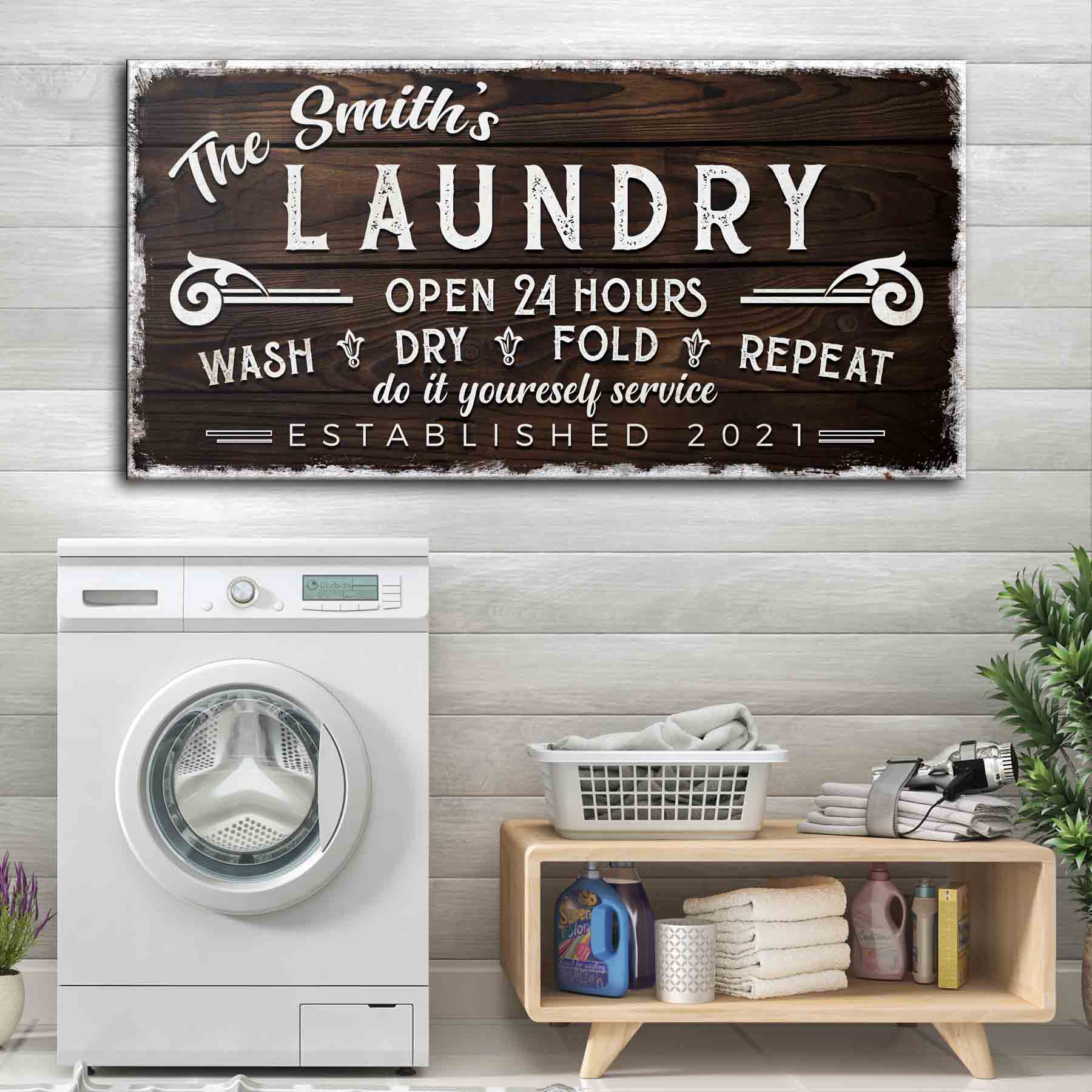 Personalized Laundry Room Sign by Tailored Canvases with white distressed lettering on dark wood on Tampa Home & Garden Store