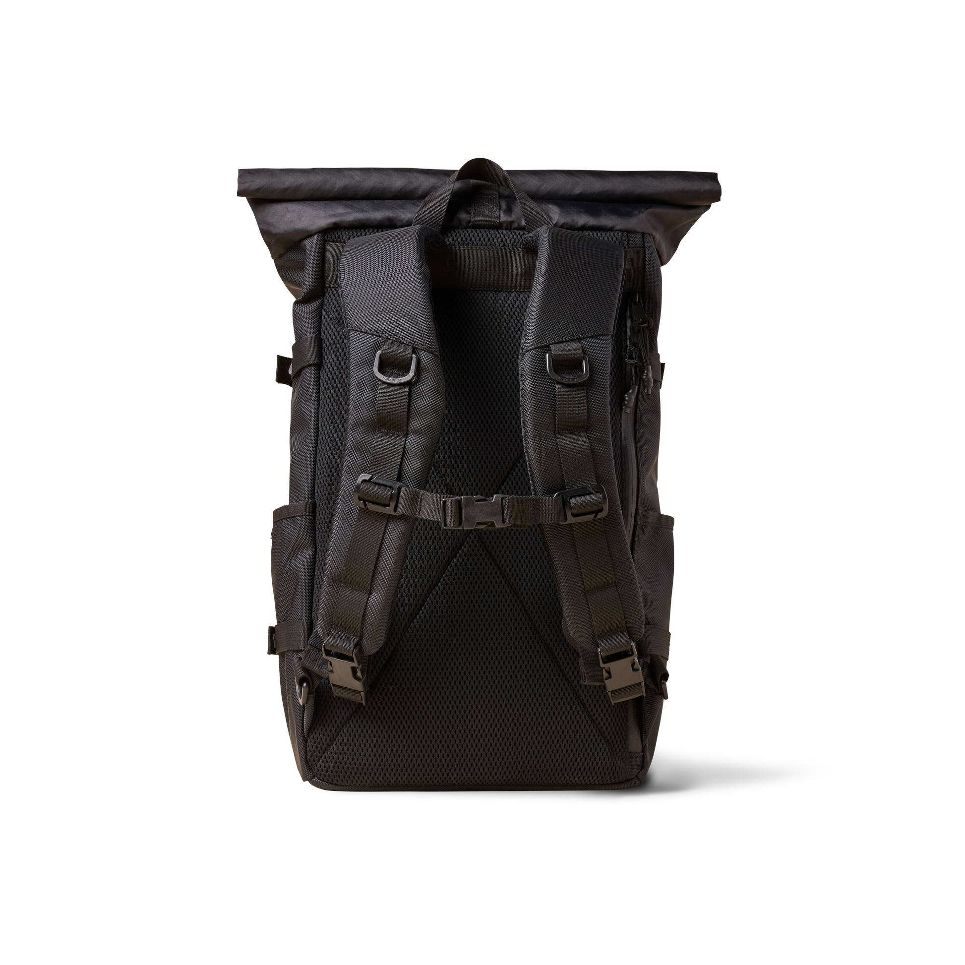 Rolltop backpack by The Brown Buffalo with padded shoulder straps and rugged black fabric on Tampa Home & Garden Store