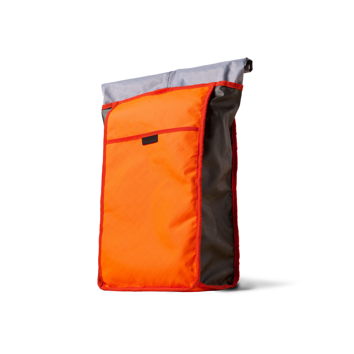 Rolltop backpack by The Brown Buffalo with orange front panel, gray top, red trim on Tampa Home & Garden Store