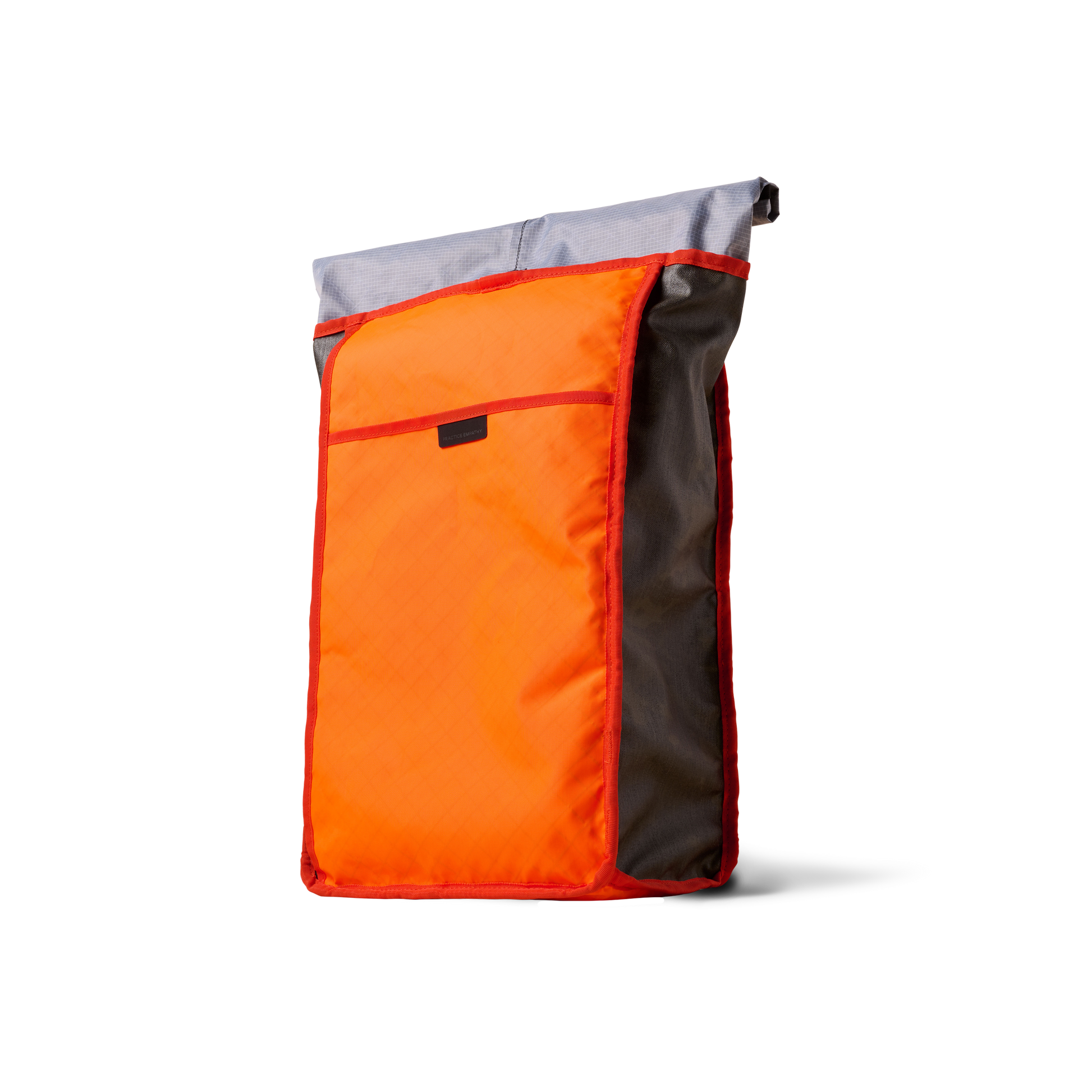 Rolltop backpack by The Brown Buffalo with orange front panel, gray top, red trim on Tampa Home & Garden Store