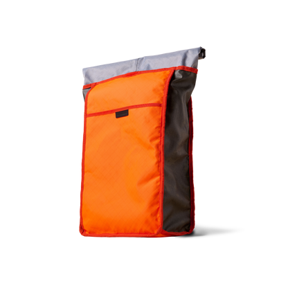 Rolltop backpack by The Brown Buffalo with orange front panel, gray top, red trim on Tampa Home & Garden Store