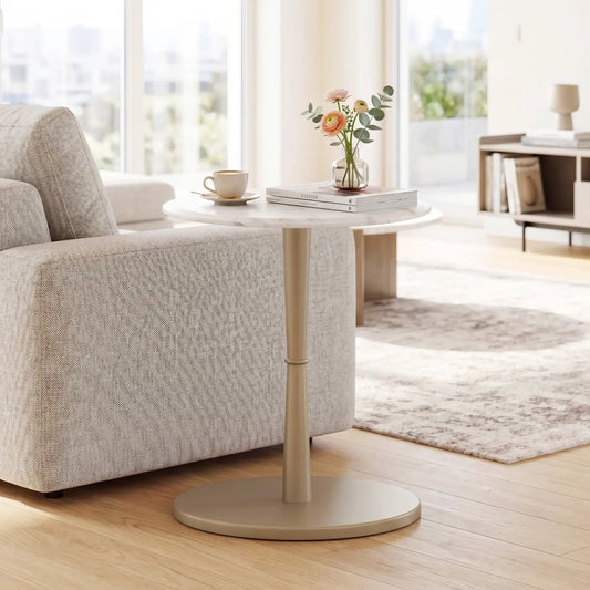 Round marble-top end table with stone finish and wooden pedestal base in living room on Tampa Home & Garden Store