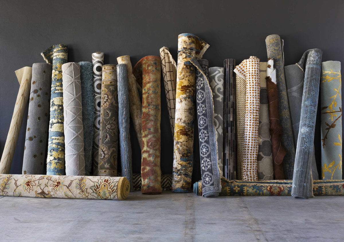 Sherwood Area Rug - Clearance, Boutique Rugs in blue gray tones against a dark wall on Tampa Home & Garden Store
