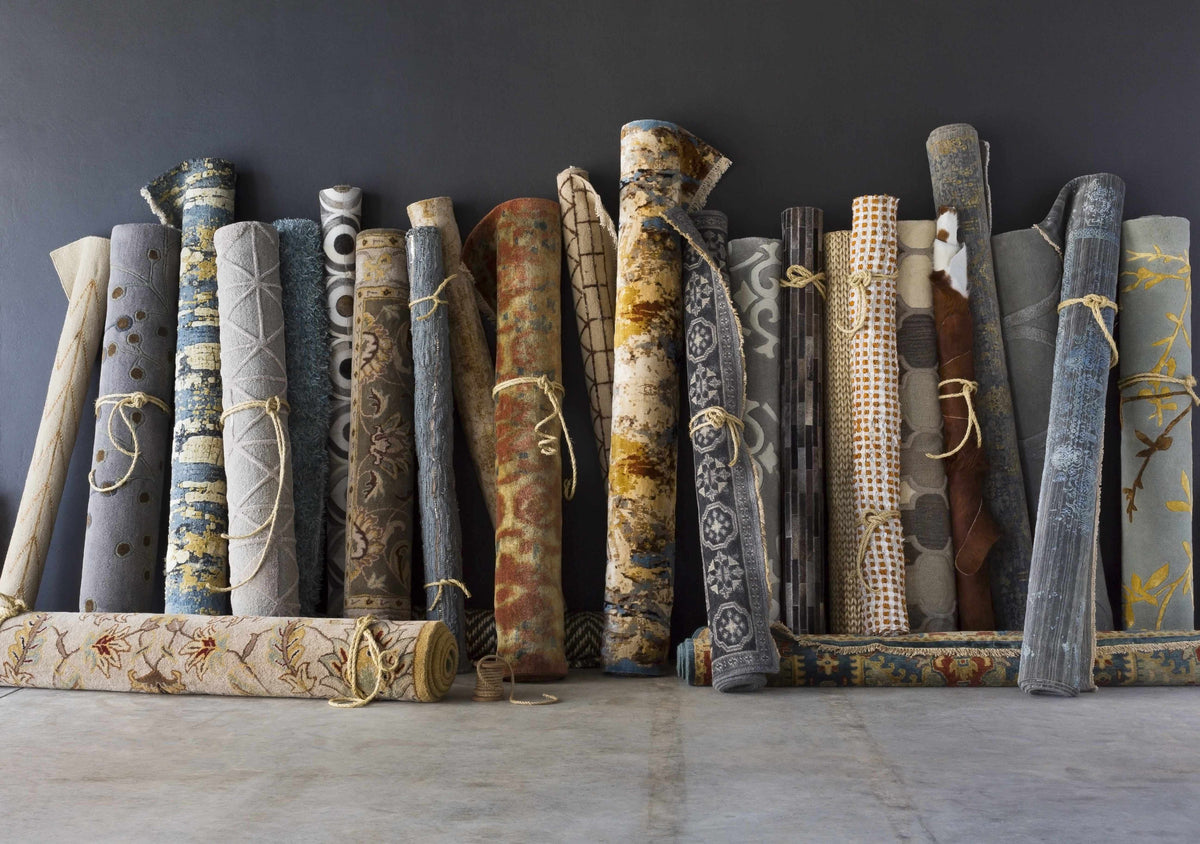 Sherwood Area Rug - Clearance, Boutique Rugs rolled collection of neutral-toned rugs bound with twine on Tampa Home & Garden Store