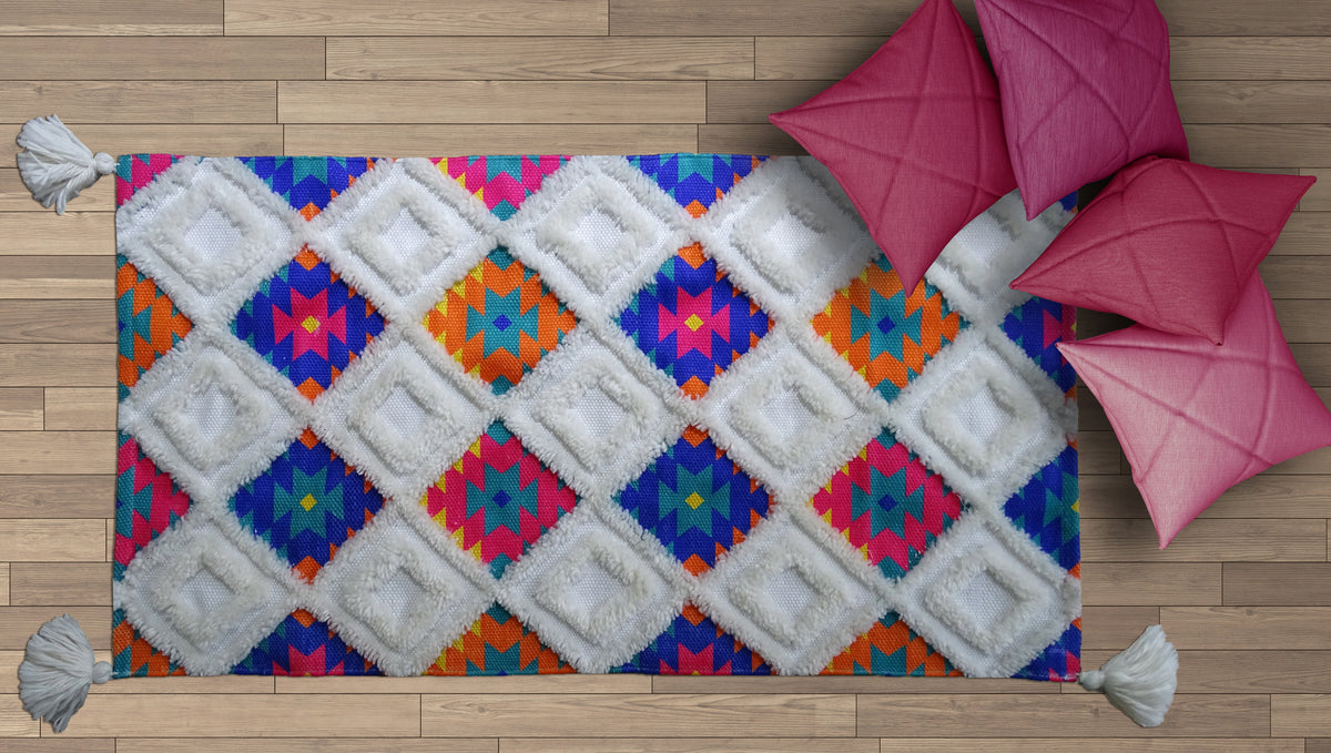 Vibhsa Accent Rug woven in multi color with geometric diamond pattern and white fringe on Tampa Home & Garden Store