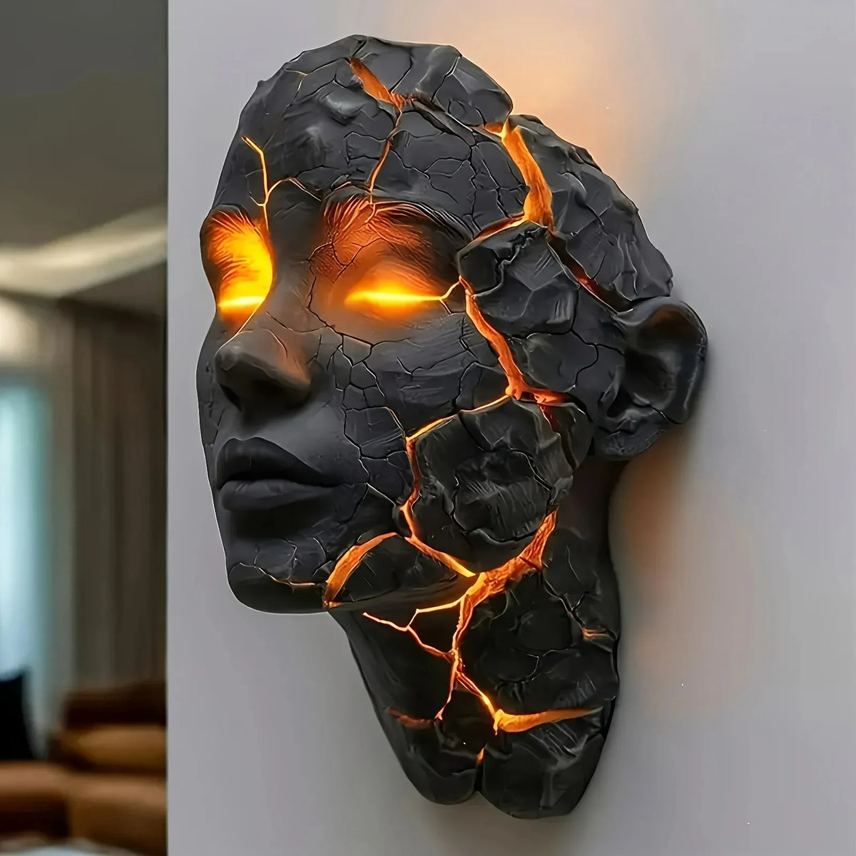 Perfecsy Cracked Soul wall light sculpture in black resin with glowing orange lava veins on Tampa Home & Garden Store