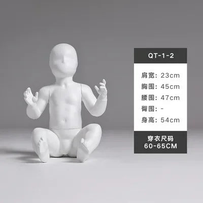 DecorBites Kids full-body mannequin, white plastic, seated pose with raised arms; 54cm height measurement card on Tampa Home & Garden Store