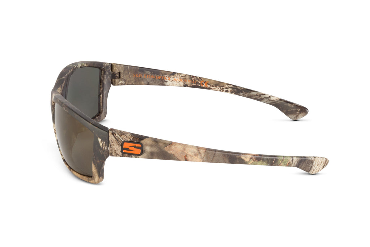 Scout sunglasses in Mossy Oak Break-Up Country camo with gray lenses and orange Skeleton Optics logo on temple on Tampa Home & Garden Store