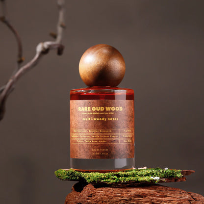 Unisex perfume bottle with round wooden cap, amber glass and Rare Oud Wood label on Tampa Home & Garden Store