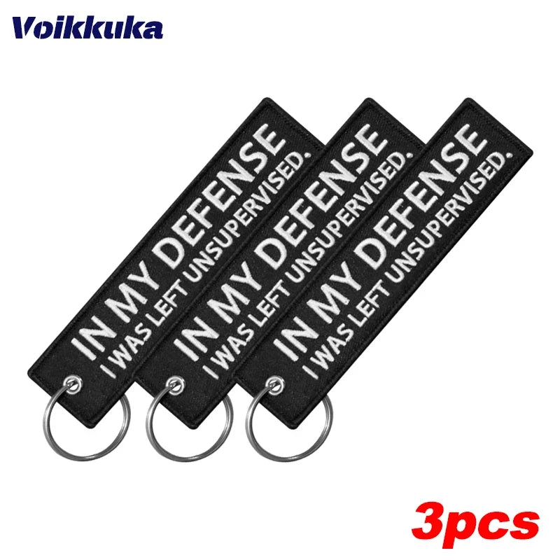 Left Unsupervised motorcycle keychain by BikerZoneZ, black patch with white text, 3-pack on Tampa Home & Garden Store