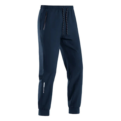 Men navy jogger pants, breathable quick-dry fabric, drawstring waist, zip pocket, UpTrend branding on Tampa Home & Garden Store