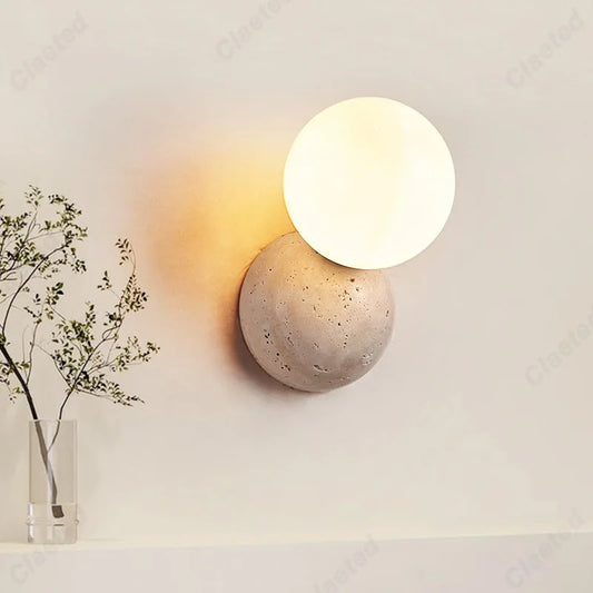 LED cream wind tunnel stone wall lamp by Perfecsy with glowing white disk on stone sphere on Tampa Home & Garden Store