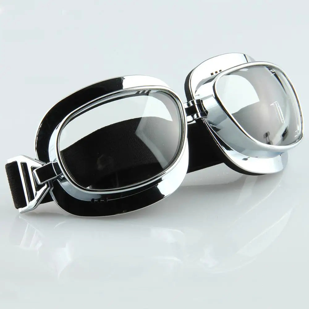 Motorcycle goggles pair with vintage chrome frame, black elastic strap, mirrored lenses on Tampa Home & Garden Store