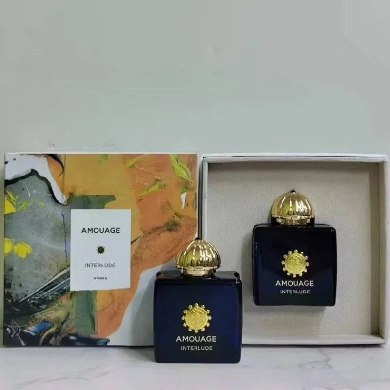 AMOUAGE Interlude perfume set: two dark blue bottles with gold caps in a colorful box on Tampa Home & Garden Store